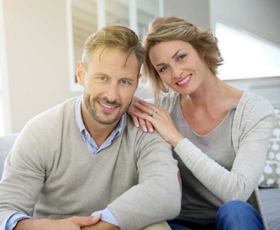 A happy couple thanks to their dental implants