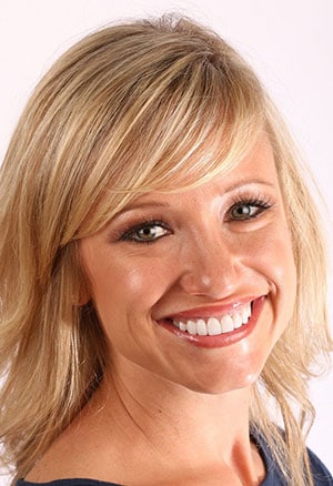 Woman after cosmetic dentistry in St. Louis